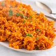 spicy nigerian jollof rice on a serving platter | Nigerian food ...