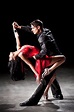 An attractive hispanic couple dancing the tango in a dance... | Танец ...