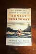 The-Complete-Short-Stories-Of-Ernest-Hemingway-Book-Laid-on-Wooden ...