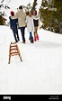Family walking in snow together Stock Photo - Alamy