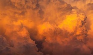 Dramatic orange sky and clouds abstract background. Top view of orange ...
