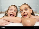 Two funny girls bathing in the bath Stock Photo - Alamy