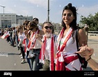 Lebanese people hold hands as they form a human chain, that stretched ...