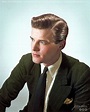 Young Roger Moore in an advertisement photograph for a hair product ...