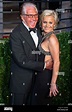 US actor George Hamilton and his partner Barbara Sturm arrive at the ...