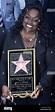 Glodean White, the wife of singer Barry White holds a replica plaque ...