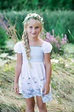 Child photography. Little girl. Long hair, white dress. Summer natural ...