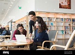 Women talking in library Stock Photo - Alamy