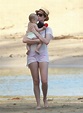 On Thursday, Anne Hathaway kissed a baby while walking on the beach ...