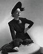 Helen Bennett Wearing A Dress And Hat by Horst P. Horst
