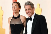 Hugh Grant Makes Matching Statement With Wife at Oscars Red Carpet ...