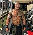 Dwayne 'The Rock' Johnson goes shirtless as he shows off his bulging ...