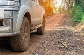 Premium Photo | Car wheels on a gravel road in tropical jungle