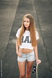 Cute beautiful teen girl with perfect body in a white T-shirt and short ...
