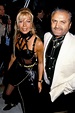 Donatella Versace with Gianni Versace wearing the famous black strap ...