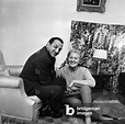 Image of Lino Ventura at home with his wife Odette Lecomte, Paris,