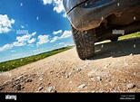 Car tires on gravel goad Stock Photo - Alamy