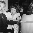 French-born actor Claudette Colbert sits with her husband, Dr. Joel ...