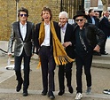 [ID] What is Keith Richards wearing on his right foot? : Sneakers