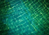 Premium Photo | Shining water ripple background.