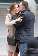 Riley Keough smiles as co-star Shaun Benson kisses her on the set of ...