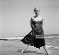 Model Jeanne Carmen pose at the beach in Los Angeles, California. News ...