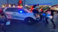 Video appears to show Detroit police car driving into protesters - CNN