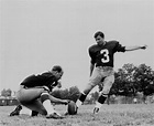 Football players Charlie Gogolak, Kicking with Dick Shine holding, 1966 ...