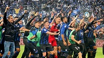 Atalanta players celebrate reaching next year's Champions League. They ...