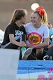 JoJo Siwa kisses girlfriend Kylie Prew as the couple hold hands and ...