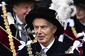 Tony Blair met with protests as Queen awards him royal honour