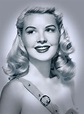 a black and white photo of a woman with blonde hair