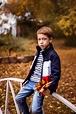 Premium Photo | Serious boy 67 years old child portrait in autumn park ...