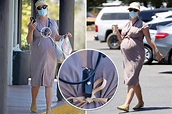 Pregnant Katy Perry wears pepper spray around her neck and a mask just ...