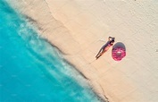 Aerial view of woman on the beach by den-belitsky on @creativemarket ...