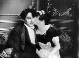 Mabel Normand kissing Charlie Chaplin, 1914 : r/OldSchoolCool