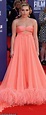 Florence Pugh stands out in an eye-catching pink feather trim gown ...