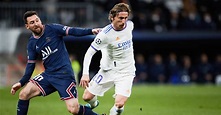 Luka Modric battles Lionel Messi for the ball during Real Madrid's win ...