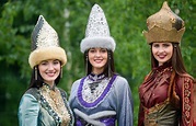 Tatar women in traditional outfits and hats during a celebration in ...