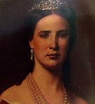an old photo of a woman wearing pearls and a tiara with her hair pulled ...