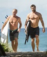 Chris Hemsworth and his father Craig show off their impressive muscles ...