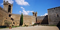 an old castle with tall towers and brick walls