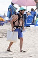 Penn Badgley goes shirtless as he enjoys a family beach day with son ...