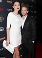 Seth Green is happily dwarfed by his statuesque (and shapely) wife ...