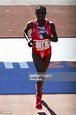 Margaret Okayo #F1 of Kenya crosses the finish during the women's ...