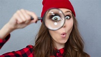 woman looking at camera through magnifying glass dreamstime_m_62137803 ...
