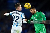 Benat Turrientes of Real Sociedad duels for the ball with Chadi Riad ...