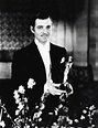 Clark Gable holds his Best Actor Oscar for “It Happened One Night” at ...