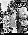 TRUE GRIT [US 1969] HAL B WALLIS [centre] with his wife MARTHA HYER and ...