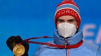 Marius Lindvik of Norway accepts his large hill gold | NBC Olympics